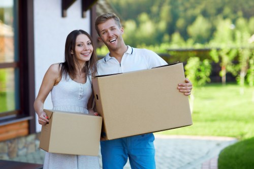 Small business moving boxes and office items with a van