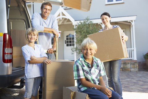 Packed moving boxes and furniture ready for transport