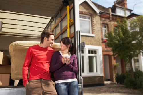 Careful loading of boxes and furniture into a removals van